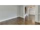Neutral colored room with hardwood flooring, offering a versatile living space at 4296 Alba Ln, Buford, GA 30519