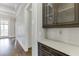 Hallway with coffered ceilings, white trim, and view of the outdoors at 4296 Alba Ln, Buford, GA 30519