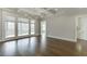 Open living area with coffered ceiling, hardwood flooring, and access to porch at 4296 Alba Ln, Buford, GA 30519