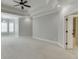 Spacious main bedroom with decorative ceiling, plantation shutters, and neutral carpet at 4296 Alba Ln, Buford, GA 30519