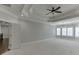Spacious main bedroom with carpet, decorative ceiling, plantation shutters and neutral walls at 4296 Alba Ln, Buford, GA 30519