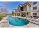 Inviting backyard pool with stone accents, loungers, and an outdoor seating area at 4296 Alba Ln, Buford, GA 30519
