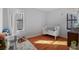 Bedroom with hardwood floors, bright windows, and a white crib at 708 Argonne Ne Ave # 5, Atlanta, GA 30308
