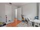 Bedroom features hardwood floors, white walls, a playful rug, and a table at 708 Argonne Ne Ave # 5, Atlanta, GA 30308