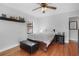 Bedroom with hardwood floors, shelf, and comfortable queen-sized bed at 708 Argonne Ne Ave # 5, Atlanta, GA 30308