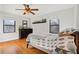 Cozy bedroom with hardwood floors, two windows for natural light, and a comfortable bed at 708 Argonne Ne Ave # 5, Atlanta, GA 30308