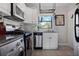 Modern kitchen with white cabinets, granite countertops, and stainless steel appliances at 708 Argonne Ne Ave # 5, Atlanta, GA 30308