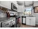 Well-lit kitchen with white cabinets, granite countertops, and stainless steel appliances at 708 Argonne Ne Ave # 5, Atlanta, GA 30308