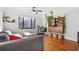 Bright living room with hardwood floors, a ceiling fan, and a cozy gray sofa with large window at 708 Argonne Ne Ave # 5, Atlanta, GA 30308