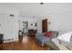 Comfortable living room with hardwood floors, open to the dining area with a gray sofa at 708 Argonne Ne Ave # 5, Atlanta, GA 30308