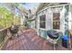Spacious wooden deck features multiple grills and plenty of room for entertaining with views at 1013 Harbor Ct, Woodstock, GA 30189