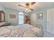 Bright bedroom with brass bed frame, quilt, and decorative touches at 1013 Harbor Ct, Woodstock, GA 30189