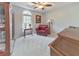 Bedroom with sitting area, wood desk, and neutral carpet at 1013 Harbor Ct, Woodstock, GA 30189