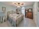 Traditional bedroom with brass bed frame, quilt and decorative touches at 1013 Harbor Ct, Woodstock, GA 30189