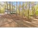 View from driveway looking up the hill to the house and carport at 1013 Harbor Ct, Woodstock, GA 30189