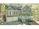 Charming two-story home with a two-car garage and white trim at 1013 Harbor Ct, Woodstock, GA 30189