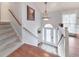 Inviting foyer with a staircase, hardwood floors, and an arched doorway leading to the main living area at 1013 Harbor Ct, Woodstock, GA 30189