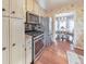 Well-appointed kitchen with stainless appliances and a view into the dining area at 1013 Harbor Ct, Woodstock, GA 30189