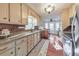 Charming kitchen with granite countertops, stainless steel appliances, and breakfast nook at 1013 Harbor Ct, Woodstock, GA 30189