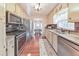 Stylish kitchen with granite countertops, stainless steel appliances, and natural light at 1013 Harbor Ct, Woodstock, GA 30189