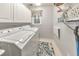Efficient laundry room with machines, storage, and modern decor at 1013 Harbor Ct, Woodstock, GA 30189