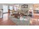 Comfortable living room with hardwood floors, neutral furnishings, and plenty of natural light at 1013 Harbor Ct, Woodstock, GA 30189