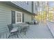 Relaxing outdoor seating arrangement on the porch with a table and chairs perfect for entertaining at 1013 Harbor Ct, Woodstock, GA 30189