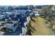 Scenic aerial view highlighting the community with a pool, green spaces, homes and mature trees in a desirable neighborhood at 155 Breakspear Ln, Fayetteville, GA 30214