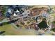Breathtaking aerial view showcasing park with playground, walking paths, serene ponds and lush landscaping at 155 Breakspear Ln, Fayetteville, GA 30214