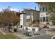 Backyard featuring an outdoor kitchen, fireplace, patio seating, and lush lawn at 155 Breakspear Ln, Fayetteville, GA 30214