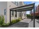 Attached carport with a metal frame and stone driveway leads to the home's entrance at 155 Breakspear Ln, Fayetteville, GA 30214