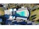Aerial view of community pool, with ample lounge chairs, surrounded by manicured grounds and sidewalks at 155 Breakspear Ln, Fayetteville, GA 30214