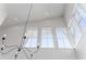 Interior shot of a home's high ceilings, many windows, and a modern chandelier at 155 Breakspear Ln, Fayetteville, GA 30214