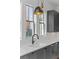 A kitchen sink is positioned in front of 3 windows in this renovated home at 155 Breakspear Ln, Fayetteville, GA 30214