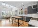 Modern kitchen featuring an island with seating, stainless steel appliances, and a breakfast nook at 155 Breakspear Ln, Fayetteville, GA 30214