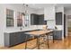Kitchen featuring gray cabinetry, stainless steel appliances, and a center island with seating at 155 Breakspear Ln, Fayetteville, GA 30214