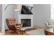 Cozy living room features a fireplace, comfortable armchair, and stylish decor at 155 Breakspear Ln, Fayetteville, GA 30214