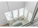 Bright living room with large windows, a modern chandelier, and comfortable seating arrangement at 155 Breakspear Ln, Fayetteville, GA 30214
