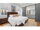 Comfortable main bedroom with ensuite bathroom and a sliding barn door at 155 Breakspear Ln, Fayetteville, GA 30214