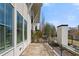Stylish patio area with views of the backyard, featuring sleek design and privacy fencing at 155 Breakspear Ln, Fayetteville, GA 30214