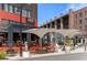 Street view of Enzo Steakhouse & Bar with outdoor seating and stylish umbrellas at 155 Breakspear Ln, Fayetteville, GA 30214