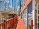 Side of the house featuring a large wooden deck, ideal for outdoor relaxation at 2466 Thrasher Rd, Buford, GA 30519