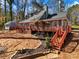 Charming home featuring a large wooden deck and beautifully landscaped backyard at 2466 Thrasher Rd, Buford, GA 30519