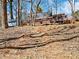Home with an expansive deck, surrounded by a wooded area that offers privacy and natural beauty at 2466 Thrasher Rd, Buford, GA 30519