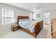 Bright bedroom with a sleigh bed, ceiling fan, and natural light from the windows at 2466 Thrasher Rd, Buford, GA 30519