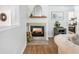 Living room fireplace area with decor and hardwood floors at 2466 Thrasher Rd, Buford, GA 30519