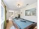 Bright game room with a pool table, light wood floors, and natural light from the windows at 2466 Thrasher Rd, Buford, GA 30519