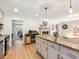 Kitchen island with bar and open to the living room and back deck access at 2466 Thrasher Rd, Buford, GA 30519