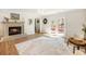 Living room with wood burning fireplace and access to the back deck at 2466 Thrasher Rd, Buford, GA 30519