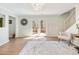 Bright living room with French doors leading to a deck and a staircase to the upper level at 2466 Thrasher Rd, Buford, GA 30519